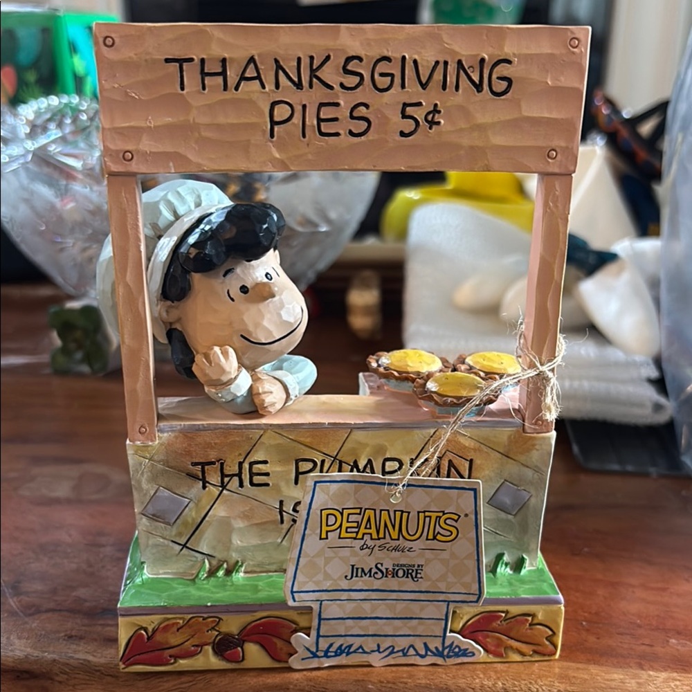 Jim Shore Peanuts Sally The Pumpkin pie stand is in Thanksgiving Pies Figurine